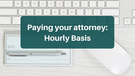 A checkbook, keyboard, mouse and the words Paying your attorney: hourly basis